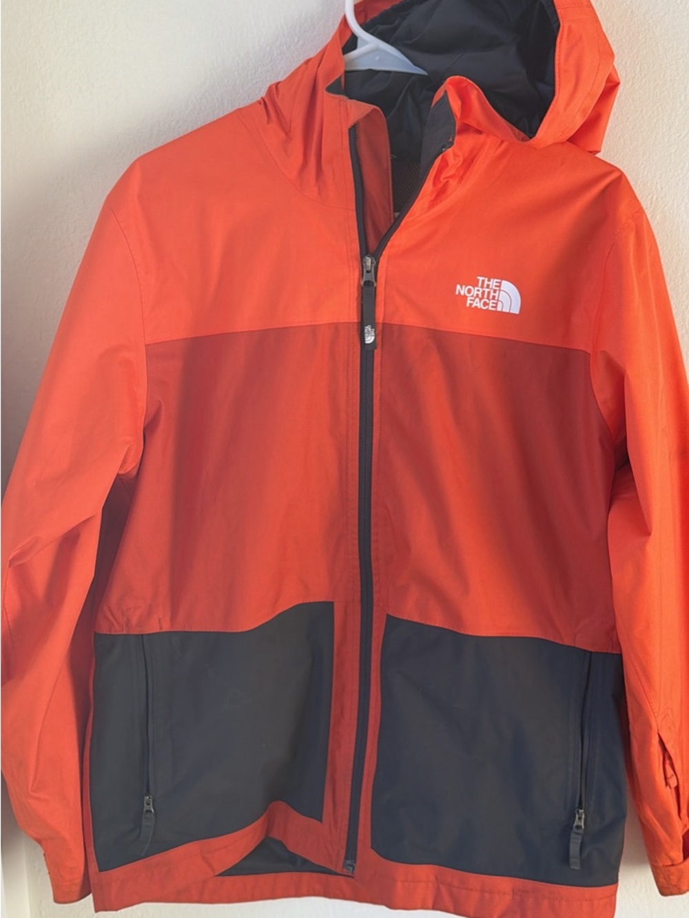 The North Face Kids Orange and Black Colorblock Hooded Rain Jacket